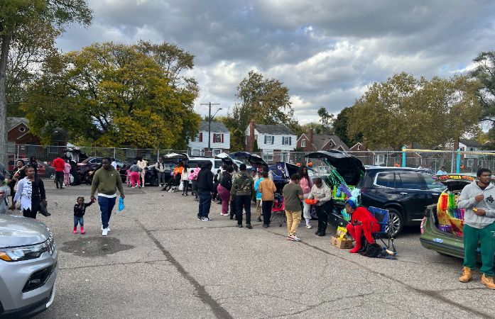 Trunks of cars decorated for Halloween and giving out candy for our students.